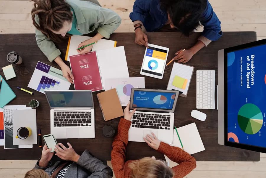 A team planning campaigns around a table