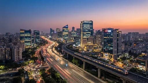 Modern Indian corporate architecture and infrastructure skyline at dusk