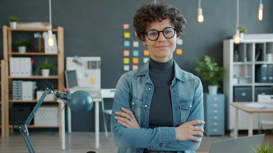 A confident woman professional in a creative office