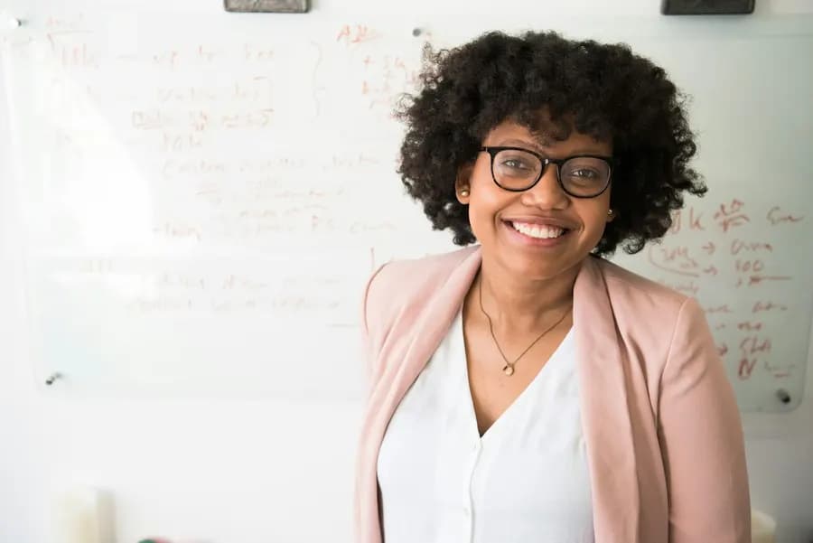 A smiling woman professional in an office