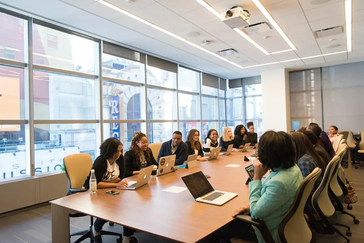 A team of women in a boardroom meeting