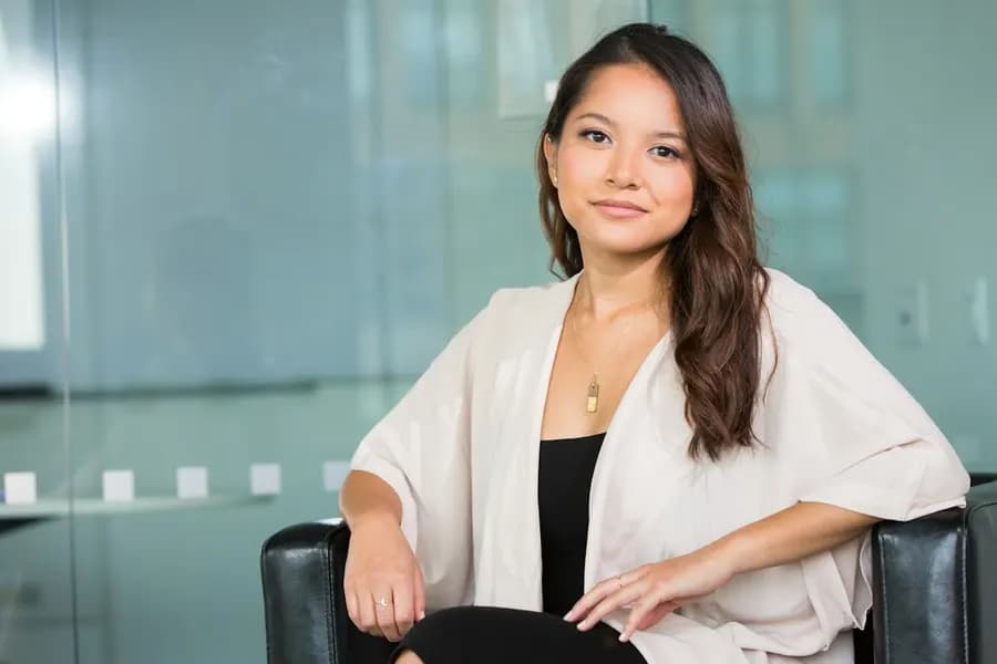 A woman professional smiling in an office